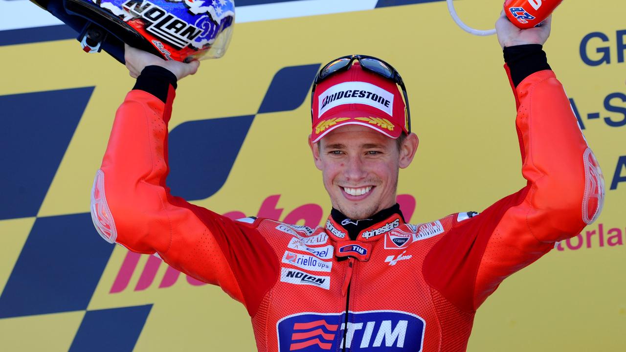 Casey Stoner celebrates his 2010 Aragon win.