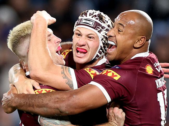 SYDNEY, AUSTRALIA - JUNE 08:  (L-R) Cameron Munster, Kalyn Ponga and Felise Kaufusi of the Maroons celebrate victory at full-time during game one of the 2022 State of Origin series between the New South Wales Blues and the Queensland Maroons at Accor Stadium on June 08, 2022, in Sydney, Australia. (Photo by Mark Kolbe/Getty Images)