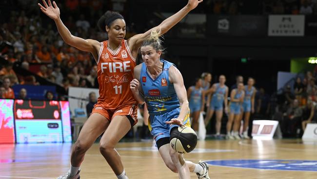 TOWNSVILLE, AUSTRALIA - MARCH 09: Sami Whitcomb of the Spirit takes the ball past Nia Coffey of the Fire during game two of the WNBL Grand Final series between Townsville Fire and Bendigo Spirit at Townsville Entertainment Centre, on March 09, 2025, in Townsville, Australia. (Photo by Ian Hitchcock/Getty Images)