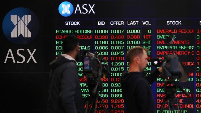 SYDNEY, AUSTRALIA - AUGUST 06: TV camera people record electronic boards displaying stock information at the Australian Securities Exchange, operated by ASX Ltd. on August 06, 2024 in Sydney, Australia. The markets are closely attuned to the RBA's next rates decision, with inflation persisting even as rates have been elevated for an extended time after the end of the COVI-19 pandemic. (Photo by Lisa Maree Williams/Getty Images)