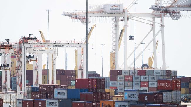 (FILES) Cargo shipping containers and cranes are seen at cargo terminals as part of the Port of Baltimore in Baltimore, Maryland, June 12, 2024, following the reopening of the shipping channel in the Baltimore Harbor after the Francis Scott Key Bridge collapsed. US President-elect Donald Trump said November 25, 2024 he intends to impose sweeping tariffs on goods from Mexico, Canada and China, prompting a swift warning from Beijing that "no one will win a trade war." In a series of posts to his Truth Social account, Trump vowed to hit some of the United States' largest trading partners with duties on all goods entering the country. (Photo by SAUL LOEB / AFP)