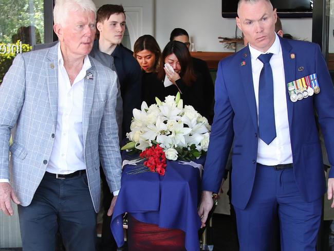 Family follow as Shaun Spain’s coffin is brought by pallbearers from his funeral service at Parkwood. Picture: Glenn Hampson.