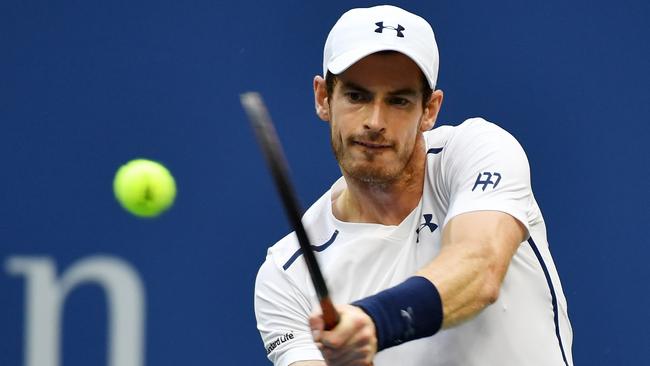Andy Murray of Great Britain returns a shot to Paolo Lorenzi.