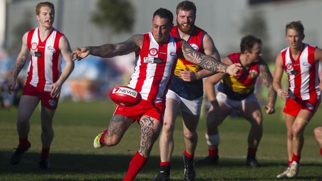 Jonathan Miller sends North Footscray into attack. Picture: Richard Serong