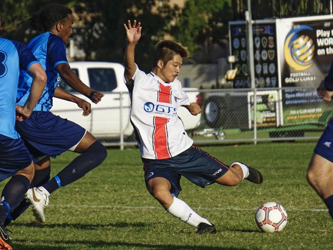 Nerang Soccer Club's Koki Miyasaka negotiates a sea of swirling Tweed Marlins during the two sides' first clash of the year in the 2019 Football Gold Coast Premier League. Picture: Luke Sorensen