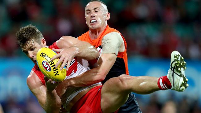 Sydney’s Luke Parker takes a mark in front of Tom Scully. Picture: Gregg Porteous