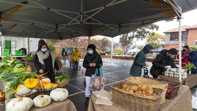 People practising social distancing at a farmer’s market in the Melbourne suburb of Coburg last year. Picture: NCA NewsWire / Daniel Pockett