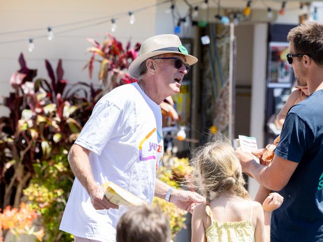 David Williamson talks to voters during voting at Coorabell Hall polling station, NSW. Picture: Luke Marsden.