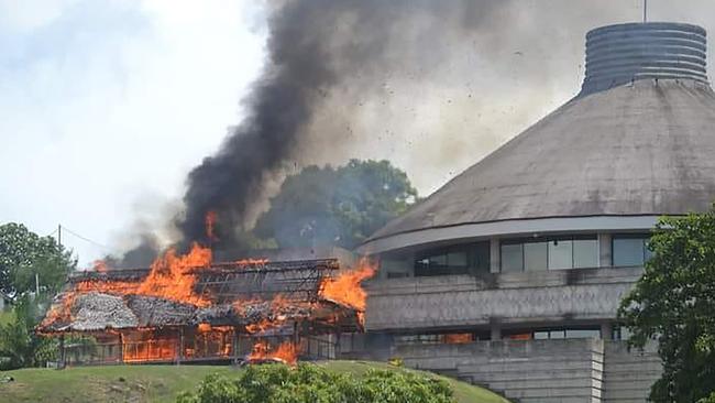 A building burns in Honiara in November. Picture: AFP