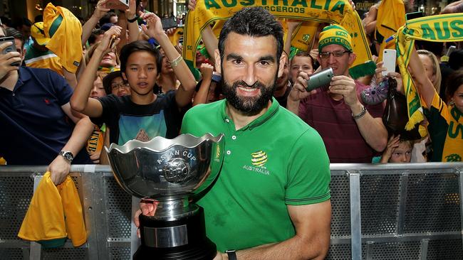 SYDNEY, AUSTRALIA - FEBRUARY 01: Socceroos captain Mile Jedinak poses with the Asian Cup during celebrations at Westfield Sydney on February 1, 2015, after the Socceroos won the 2015 Asian Cup last night, in Sydney, Australia. (Photo by Mark Metcalfe/Getty Images)