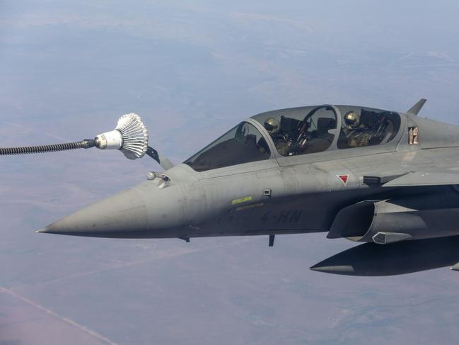 A French Rafale jet refuels mid-air about 100km south of Darwin. Picture: Floss Adams.