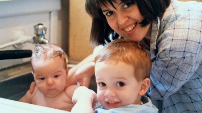 Proud big brother Luke with his mum Pauline Field and baby sister Bernadette, who died of SIDS in 1998. Picture: Supplied