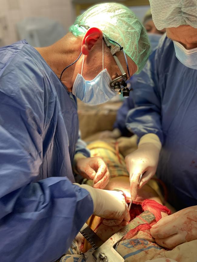 Dr Craig Jurisevic operating on a wounded Ukrainian soldier.