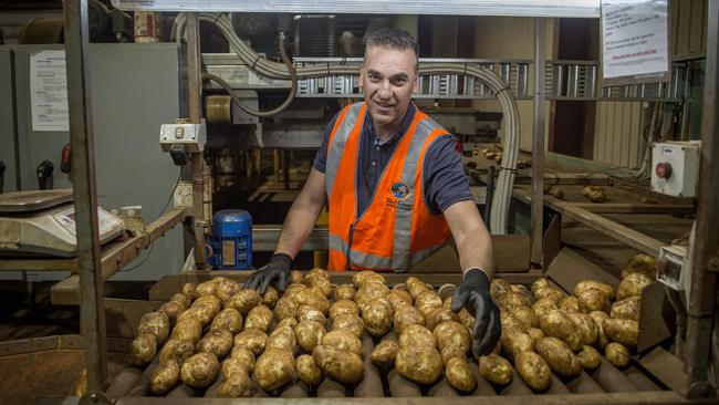 Rolling out: Robert Cerchiaro in his potato packing shed in Nar Nar Goon. Picture: Zoe Phillips