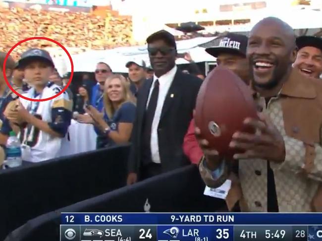 Young fan looks on at Mayweather.