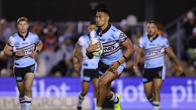 SYDNEY, AUSTRALIA - JULY 12:  Ronaldo Mulitalo of the Sharks runs the ball during the round 19 NRL match between Cronulla Sharks and Wests Tigers at PointsBet Stadium on July 12, 2024, in Sydney, Australia. (Photo by Brendon Thorne/Getty Images)