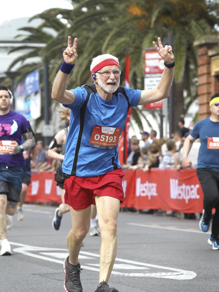 CITY to BAY - FINISH LINE. John,72, (no last name given) of Colonel Light Gardens crosses the finish line.15 September 2019. (AAP Image/Dean Martin)