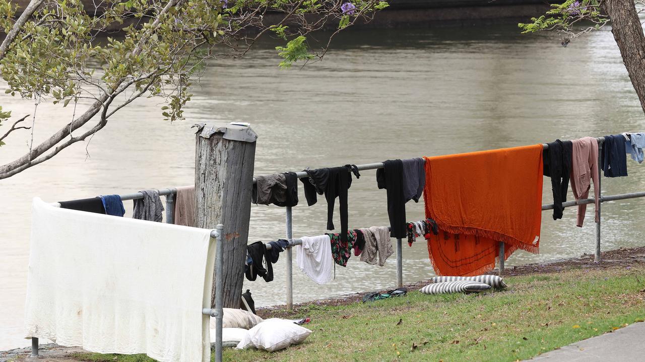 Homeless washing their cloths by the river, under William Jolly Bridge, South Brisbane. Picture: Liam Kidston