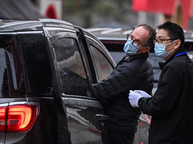 Scientist Peter Ben Embarek (L), leaves with other members of the WHO team investigating the origins of COVID-19 in Wuhan. Picture: AFP