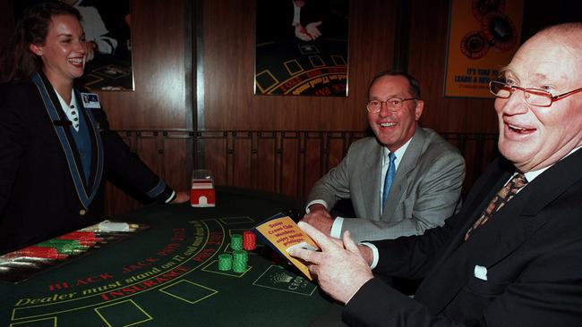 Kerry Packer (right) and Lloyd Williams chat at the blackjack table at Crown Casino croupier back in 1997. Picture: File