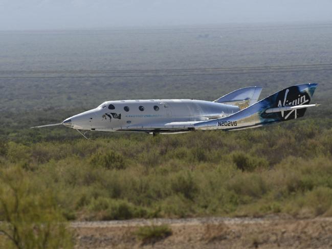 The Virgin Galactic SpaceShipTwo space plane Unity returns to earth after the mothership separated, at Spaceport America, near Truth and Consequences, New Mexico. Picture: AFP