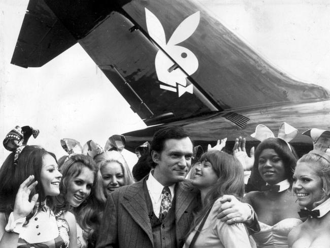 Hugh Hefner gets a kiss from his girlfriend at the time, Barbara Benton, under the tail of his 'Big Bunny'. Picture: Keystone.