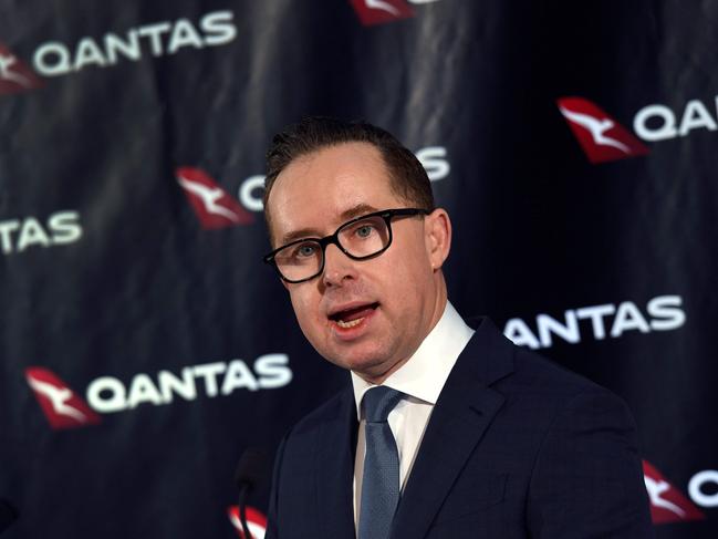 Qantas chief executive officer Alan Joyce speaks during a press conference for the announcement of the airline's half-year results in Sydney on February 23, 2017. Australian carrier Qantas Airways posted on February 23 a 7.5 percent hit to first half earnings, impacted by lower fares, greater competition and empty seats. / AFP PHOTO / William WEST