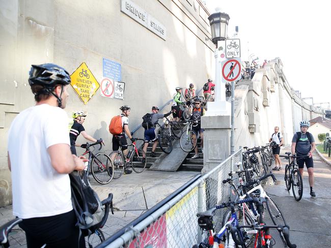 Cyclists have to push their bikes up this staircase to access the bridge. Picture: Carly Earl
