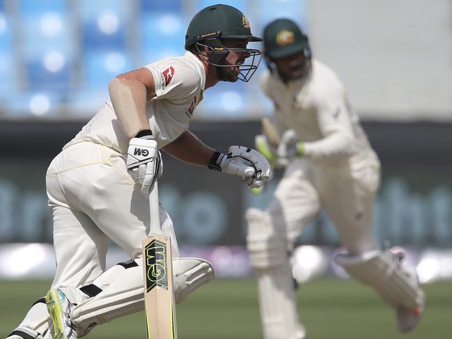 Australian batsmen Travis Head (left) and Usman Khawaja during Australia’s second innings against Pakistan. Picture: AP