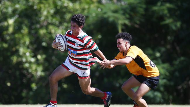 North Queensland's Jayvan Scarff is tackled by Central Queensland's Tanushk Ricketts in the Queensland Country Rugby Union Championship Under-19s men's match between North Queensland and Central Queensland, held at Machans Beach. Picture: Brendan Radke