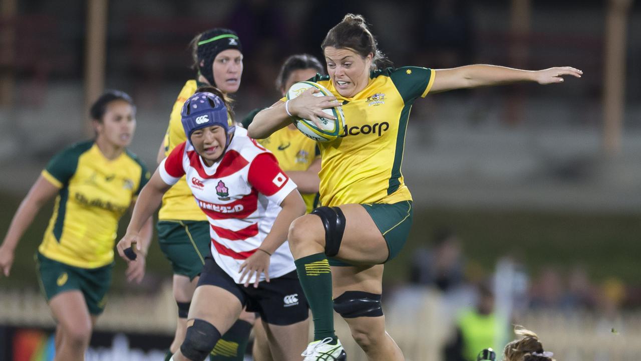 Grace Hamilton of the Wallaroos scores.