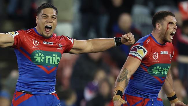 NEWCASTLE, AUSTRALIA - JULY 22: Jacob Saifiti and Adam Elliot of the Knights react to the teams win  during the round 21 NRL match between Newcastle Knights and Melbourne Storm at McDonald Jones Stadium on July 22, 2023 in Newcastle, Australia. (Photo by Scott Gardiner/Getty Images)