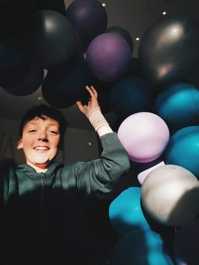 Rachel Devine’s son with the Pay It Forward balloons.