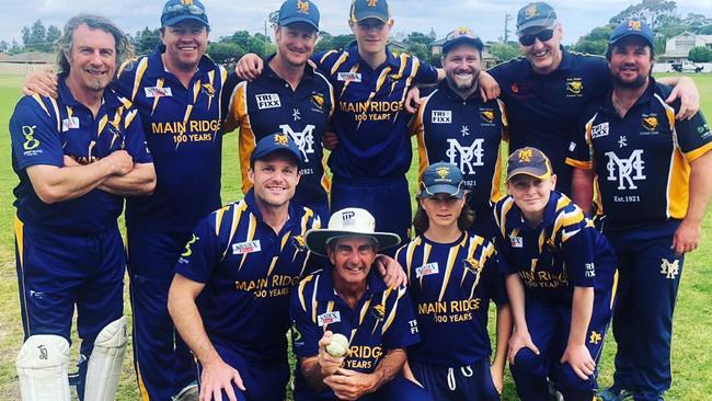 Lloyd Hosking, holding the ball, is surrounded by his Main Ridge teammates after taking his 500th wicket. Picture: Facebook