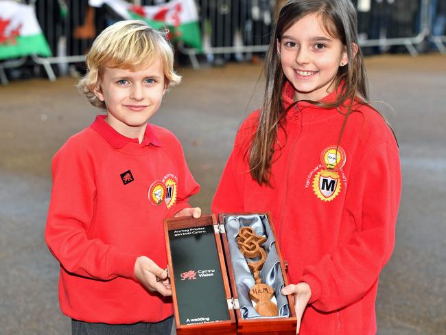 Harry Smith and Megan Taylor, both from Marlborough Primary School, with a wedding gift for Britain's Prince Harry and his fiancee US actress Meghan Markle. Picture: AFP PHOTO / POOL / Ben Birchall