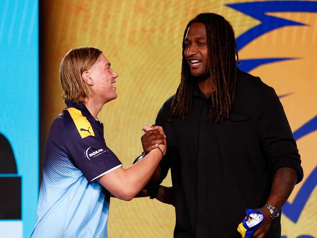 MELBOURNE, AUSTRALIA – NOVEMBER 20: Harley Reid is presented with his jumper by Nic Naitanui of the Eagles after being selected with the number 1 pick by the West Coast Eagles during the 2023 AFL Draft at Marvel Stadium on November 20, 2023 in Melbourne, Australia. (Photo by Michael Willson/AFL Photos via Getty Images)