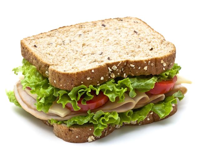 EMBARGO FOR TWAM, 08 FEBRUARY 2025. FEE MAY APPLY. Healthy turkey sandwich with swiss cheese, lettuce and tomato. Isolated with soft shadow.