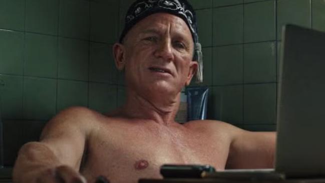 Book just out of shot ... Daniel Craig in bath from Glass Onion: A Knives Out Sequel. Netflix