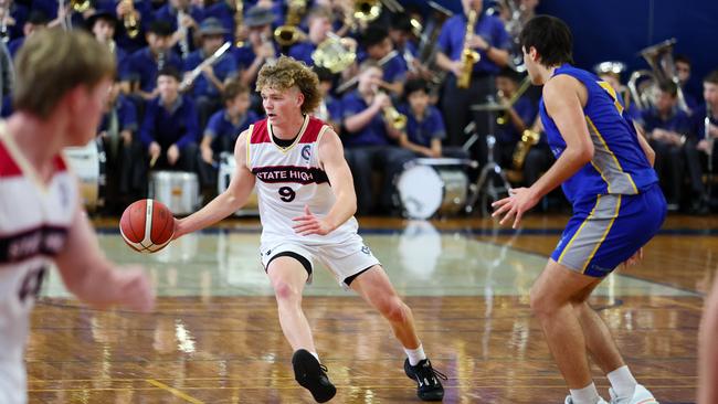 Action from the GPS basketball round 1 match between Brisbane State High and Churchie. Picture: Tertius Pickard