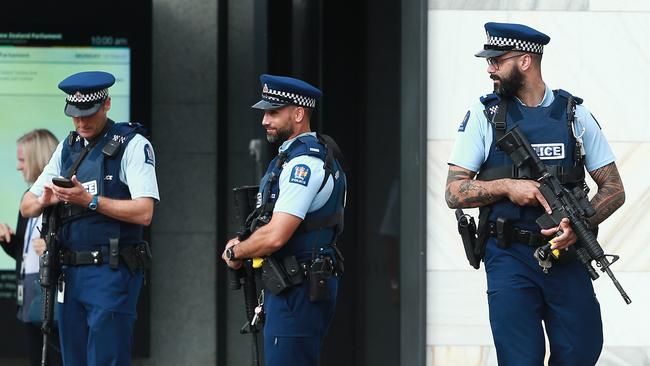 Armed police officers patrol the grounds of parliament in Wellington, New Zealand. Picture: Getty