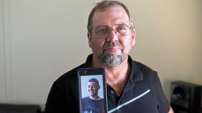 Andrew Gordon with a photo of his son David who died after a motorcycle accident at Bucasia Beach on Sunday night. Picture: Emma Murray