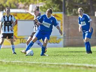 Rockville's Dawn Holden takes possession of the ball during last year's Toowoomba Football League Premier Women's grand final. Holden captained Rockville in their loss to Highfields at the weekend. Picture: Kevin Farmer