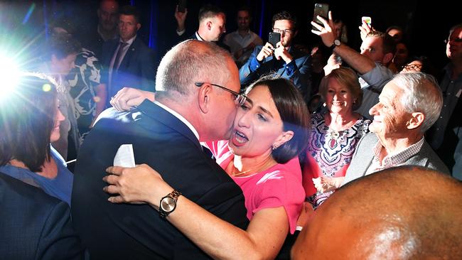 NSW Premier Gladys Berejiklian hugs Prime Minister Scott Morrison at the Coogee Bay Hotel in Sydney last night. Picture: Mick Tsikas/AAP