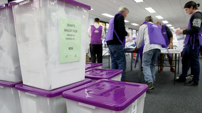 Australian Electoral Commission workers started counting pre-poll and postal election votes on Tuesday. Picture: Troy Snook