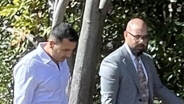 Samir Basnet with his lawyer outside Hornsby Local Court.