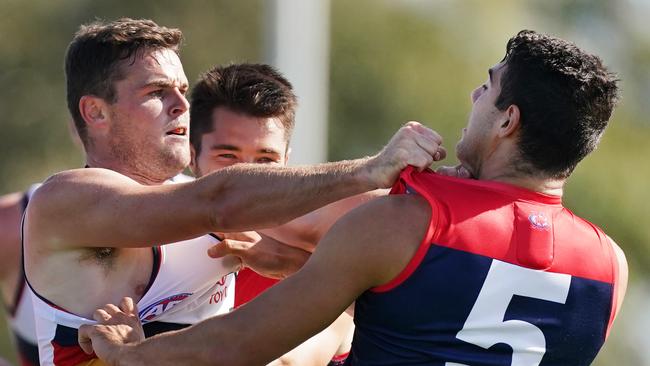 Brad Crouch of the Crows wrestles with Christian Petracca of the Demons during a pre-season game this year. Picture: AAP Image/Michael Dodge