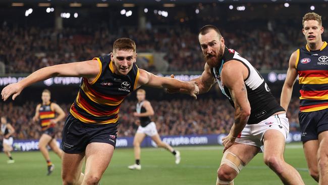 ADELAIDE, AUSTRALIA – JULY 29: Mark Keane of the crows and Charlie Dixon of the Power during the 2023 AFL Round 20 match between the Adelaide Crows and the Port Adelaide Power at Adelaide Oval on July 29, 2023 in Adelaide, Australia. (Photo by Sarah Reed/AFL Photos via Getty Images)