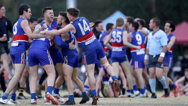 Wandin players celebrate the club’s grand final triumph. Picture: Mark Dadswell