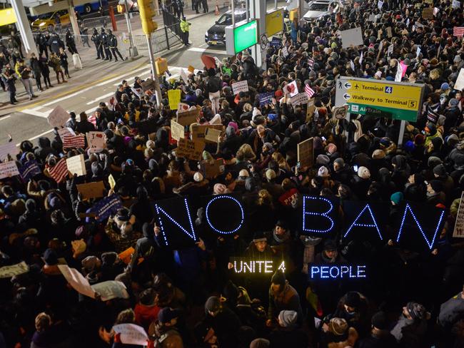 Protesters rally during a demonstration against the Muslim immigration ban at John F. Kennedy International Airport in New York City. Picture: Getty