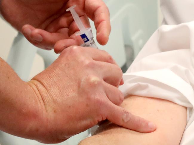 ADELAIDE, AUSTRALIA NewsWire Photos June 30: COVID VACCINE HUMAN TRIALSHuman trials of covid vaccine to start at RAH (Royal Adelaide Hospital). Guy Ludbrook, Professor of Anaesthesia, administers the first vaccine to Pharmacist, Ian Tindall.  NCA NewsWire / Dean Martin